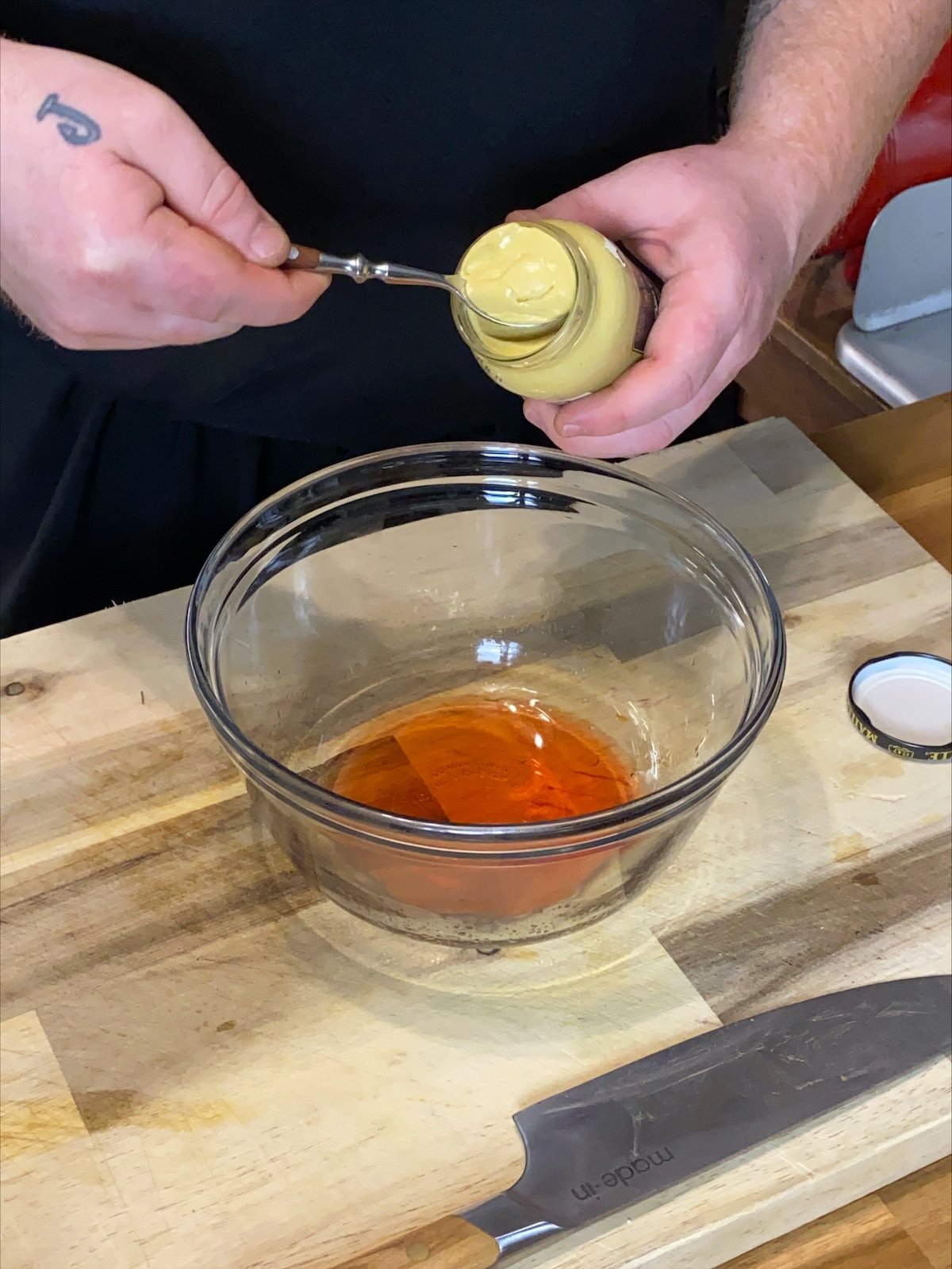 Adding the dijon mustard.