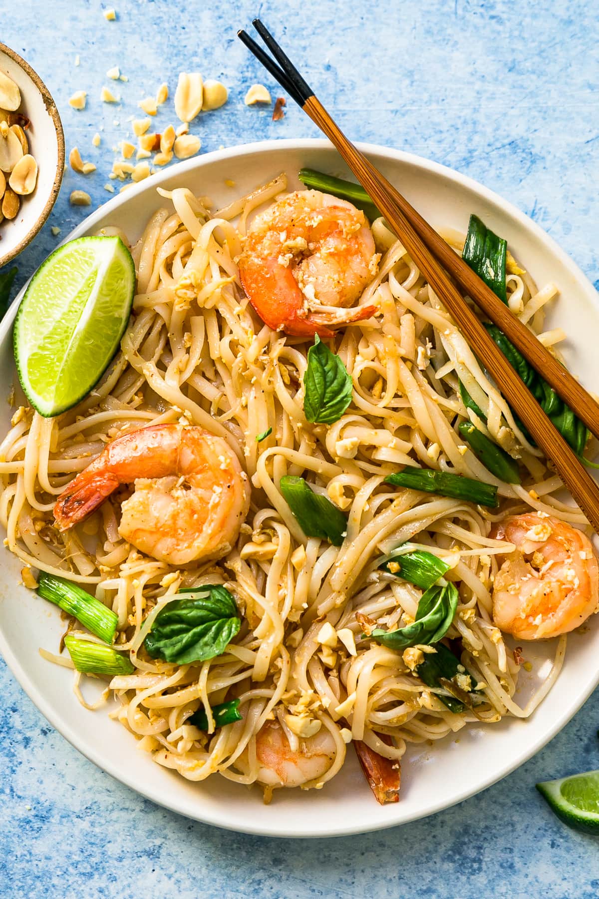 Overhead view of homemade Pad Thai in bowl with chopsticks
