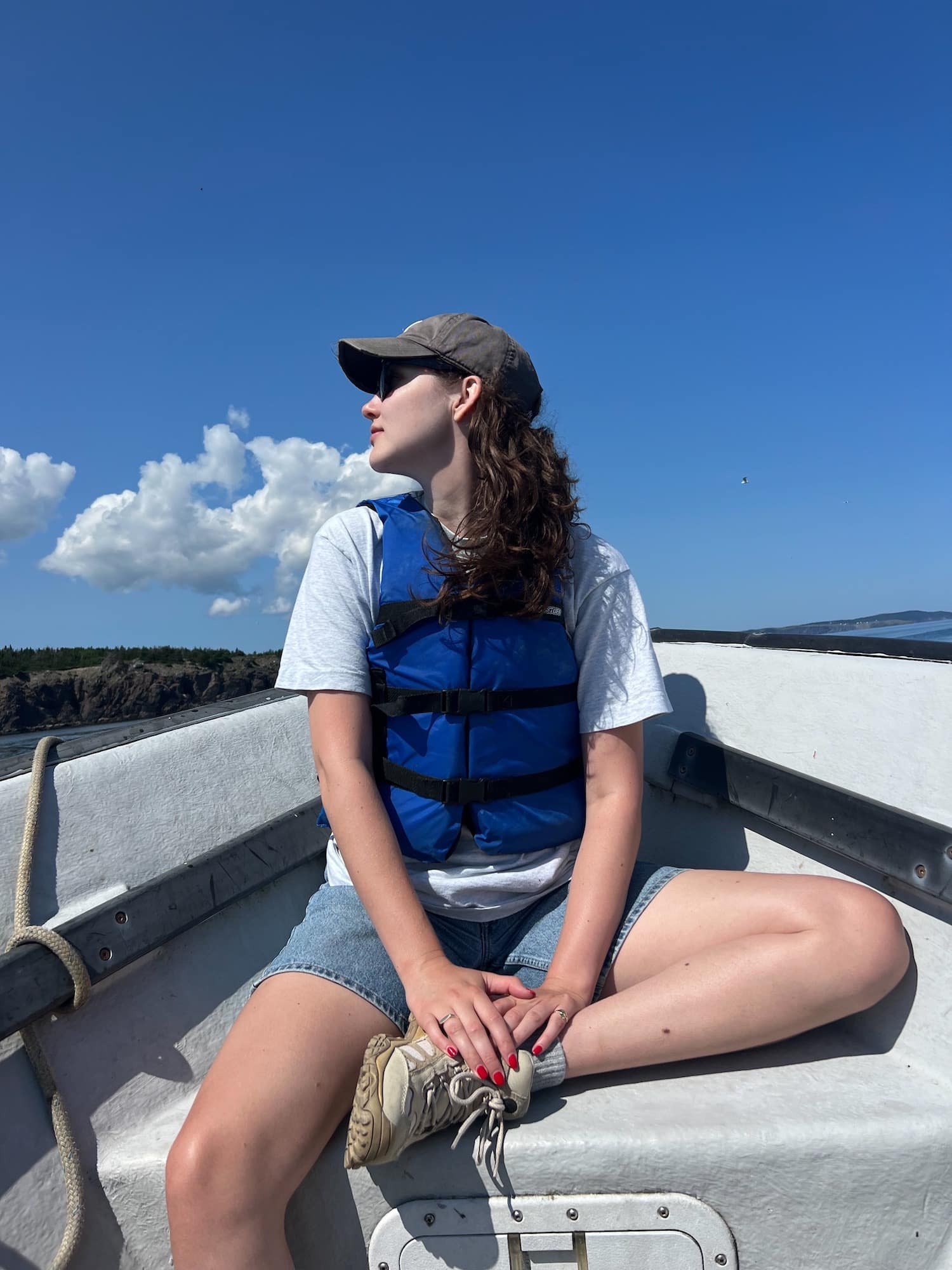Olivia on the boat in Ochre Pit Cove.