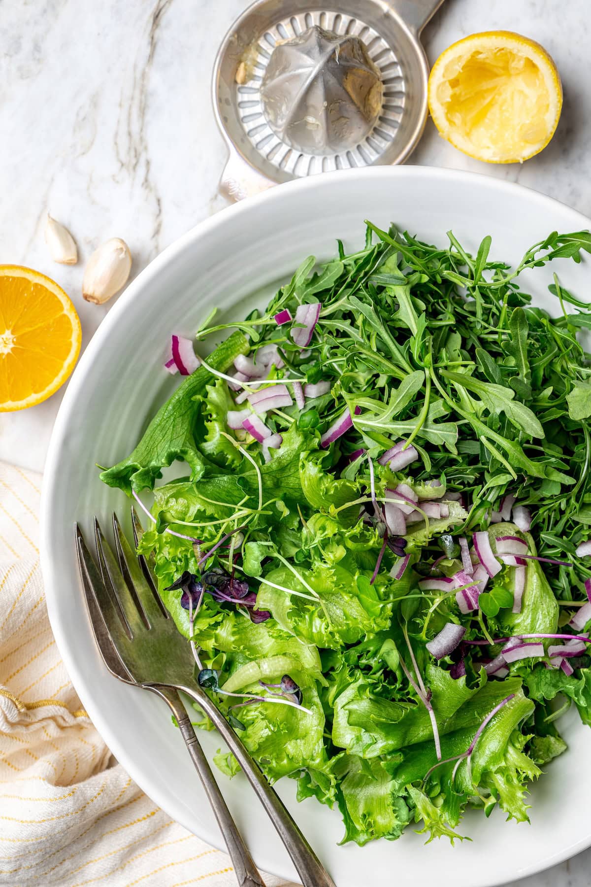 Overhead view of salad with red onions