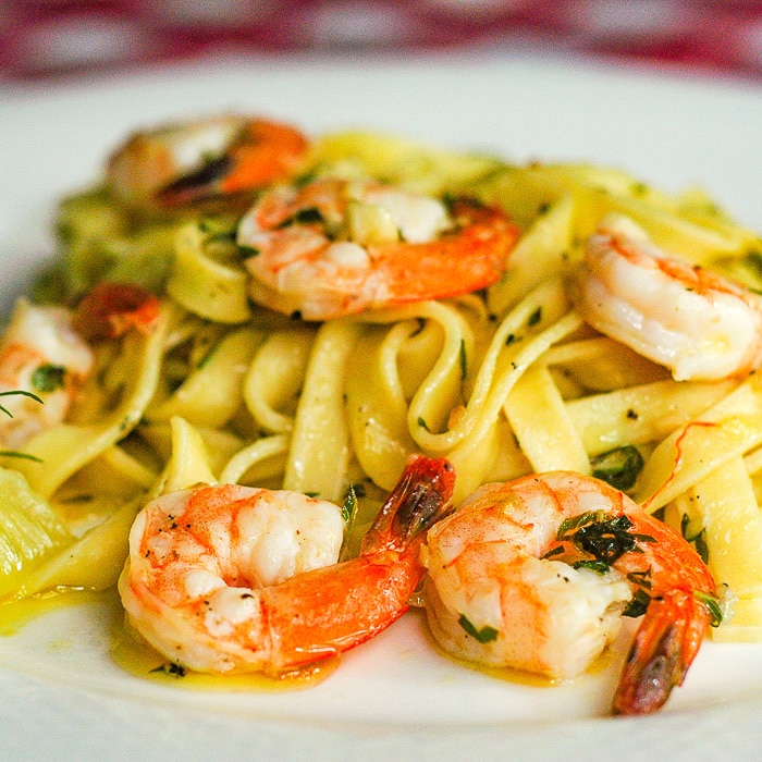 Super Simple Shrimp Scampi close up photo of a single serving on a white plate