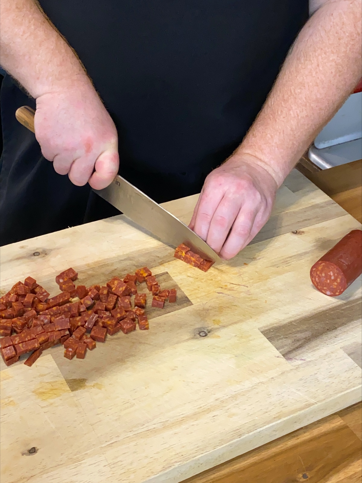 Chopping chorizo for Surf & Turf Sharing Platter