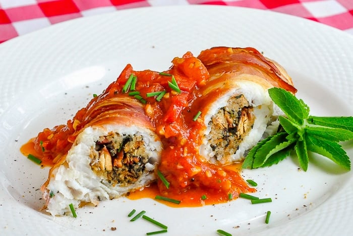 Stuffed Cod a la Empire wide horizontal shot of single serving on a white plate