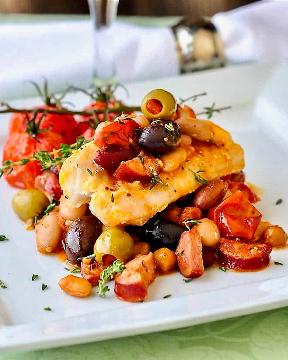 Baked Cod with 5 Beans & Chorizo close up ohoto of one serving.